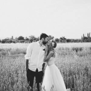 dramatic black and white photoshoot with bride and groom in a wheat filed near Bardovci in Skopje | https://milenkovikweddings.com/